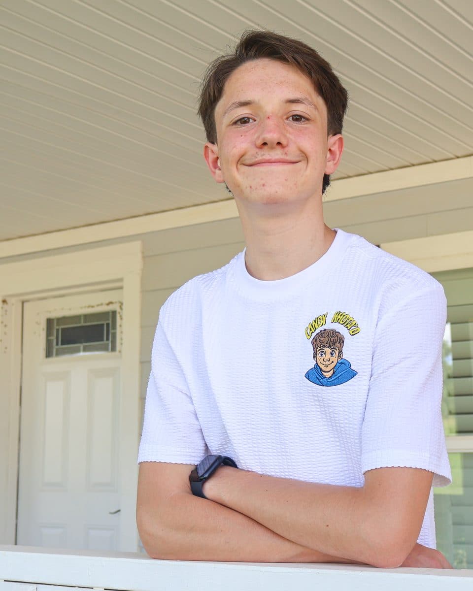 Khota on the front porch in a Candy Khota’d t-shirt